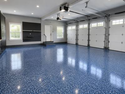 Blue flake floor running the width of a three bay garage