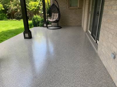Covered back patio sealed with a grey flake coating