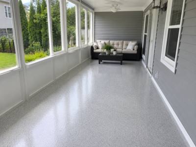 Enclosed porch floor coated in a light grey flake system