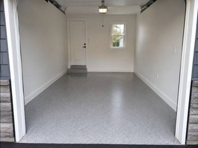 Grey flake coating in a single car garage, open to the driveway